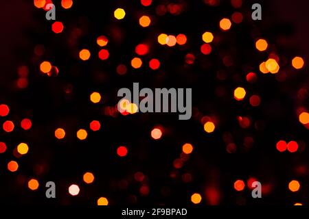 Various blurry red lights on black background. Stock Photo