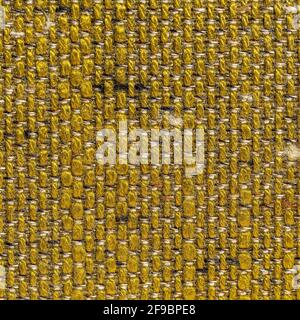 Rustic canvas fabric texture in dark yellow woven color. Stock Photo