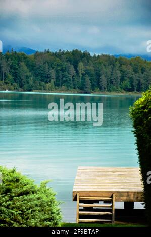 Fantastically beautiful mountain lake, with a jetty that protrudes into the water and a mountain panorama in the background
