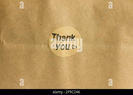Thank you tag on craft paper Stock Photo