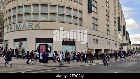 Long queue of customers, shoppers, waiting to go into Primark after covid lockdown allowed stores to open Stock Photo