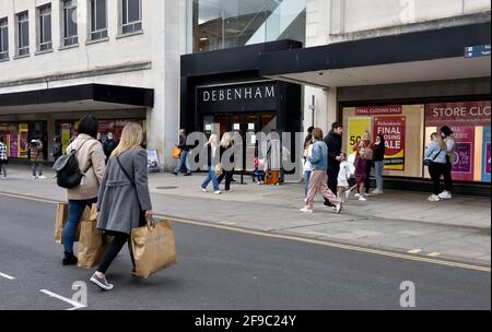 Debenhams department store with closing down sale, customers queuing outside Stock Photo