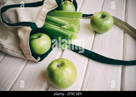 green apples and celery in an eco bag Stock Photo