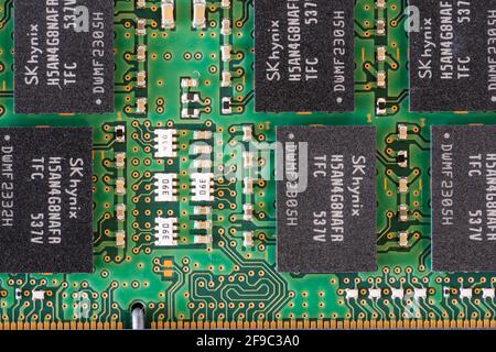 A macro closeup of the motherboard in a Dell laptop showing DRAM (Dynamic Random Access Memory) chips and electronic circuits Stock Photo
