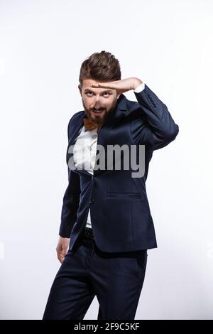 Elegant young handsome man in black classic costume. Studio fashion portrait. Stock Photo