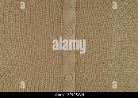 Fragment of a knitted garment. Pleat with buttons. Stock Photo