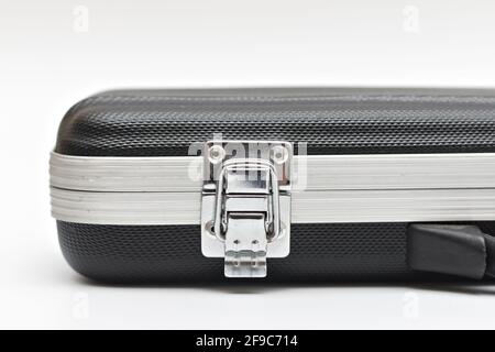 A lock on a small black suitcase. Studio photo on white background Stock Photo