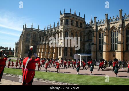 Members of the Massed Band of the Household Division watched by members of the Royal family from the Galilee Porch of St George's Chapel, Windsor Castle, Berkshire, during the funeral of the Duke of Edinburgh. Picture date: Saturday April 17, 2021. Stock Photo