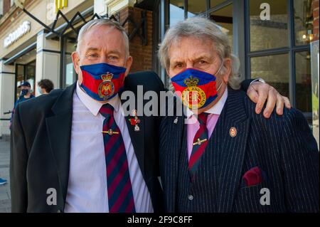 Windsor, Berkshire, UK. 17th April, 2021. Thomas Steven and Geoff York proudly wear their guard ties. Locals and visitors came into Windsor today to pay their respects to HRH Prince Philip on his funeral day, however, many heeded advice and stayed away due to the ongoing Covid-19 Pandemic. There was a heavy presence of armed police in the town together with numerous RBWM stewards. The funeral for the Duke of Edinburgh was a private event held at St George’s Chapel in the grounds of Windsor Castle. Credit: Maureen McLean/Alamy Live News Stock Photo