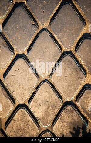 Diamond-shaped tread for a car tire in warm colors Stock Photo