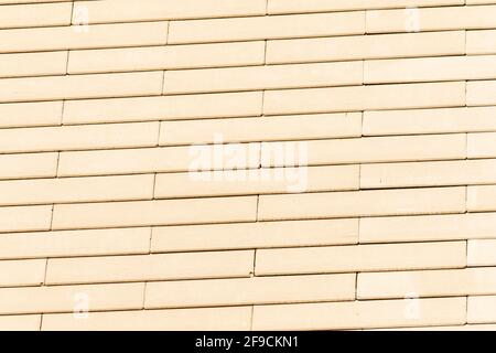 Elongated sand brick texture wall Stock Photo