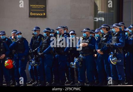 London, United Kingdom. 17th April 2021. Police officers wearing protective face masks stand by at the Kill The Bill protest. Crowds once again marched through Central London in protest of the Police, Crime, Sentencing and Courts Bill. Credit: Vuk Valcic/Alamy Live News Stock Photo