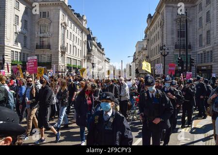 London, United Kingdom. 17th April 2021. Demonstrators walk through Piccadilly Circus during the Kill The Bill protest. Crowds once again marched through Central London in protest of the Police, Crime, Sentencing and Courts Bill. Credit: Vuk Valcic/Alamy Live News Stock Photo