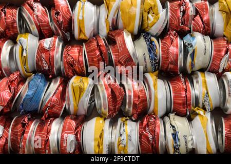 Side view of 40 crushed aluminum cans for beer and cider beverages ready for recycling Stock Photo