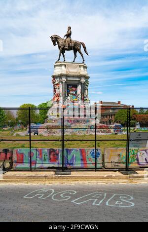 The Lee Monument in Richmond, Virginia with graffiti after protests of the killing of George Floyd and calls for its removal. ACAB graffiti on street. Stock Photo