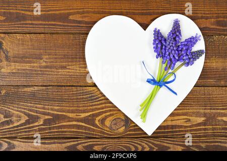 Happy Mothers Day card with Mothers Day flowers and heart decoration Stock Photo