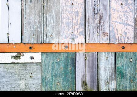 weathered old wooden wall design with faded paint Stock Photo