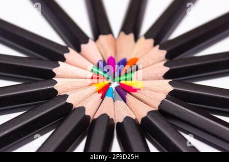 Colored pencils for drawing folded in a circle. Childhood concept, brightness, fun Stock Photo