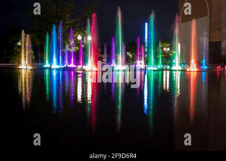 Long exposure of a colourful outdoor fountain - water and light moving to the music - unique shopping experience in Merida, Mexico