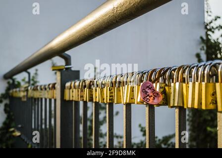 Petrovaradin, Serbia - July 17. 2019: Petrovaradin fortress; Padlocks of love on the fence Stock Photo