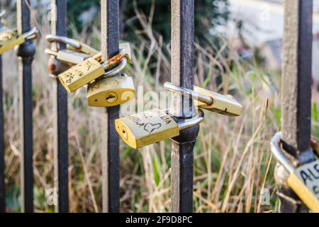 Petrovaradin, Serbia - July 17. 2019: Petrovaradin fortress; Padlocks of love on the fence Stock Photo