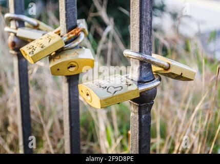 Petrovaradin, Serbia - July 17. 2019: Petrovaradin fortress; Padlocks of love on the fence Stock Photo