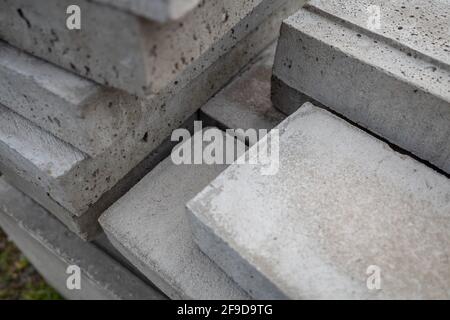 Selective focus, stack of concrete blocks. Building material cement cube bricks. Stock Photo