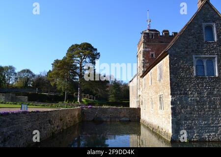 Ightham Mote in spring, a Tudor, medieval, moated house in north west Kent in April, bright sunny day. Lovely gardens. National Trust. Near Sevenoaks Stock Photo