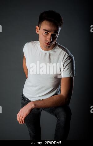 Portrait of an an attractive young male model wearing a trendy modern clothes Stock Photo
