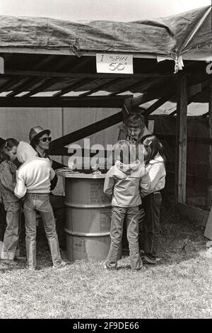 Children playing at a game of chance at the Dog Pound Rodeo and fairground, Alberta Canada circa 1982 Stock Photo