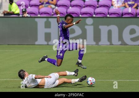 Orlando, Florida, USA. April 17, 2021: Orlando City SC midfielder ANDRES PEREA (21) leaps over Atlanta United midfielder SANTIAGO SOSA (5) during the Orlando City vs Atlanta United match at Exploria Stadium in Orlando, Fl on April 17, 2021. Credit: Cory Knowlton/ZUMA Wire/Alamy Live News Stock Photo