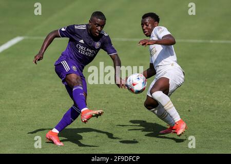 Orlando, Florida, USA. April 17, 2021: Orlando City SC midfielder JHEGSON SEBASTIAN MENDEZ (8) competes for the ball against Atlanta United defender GEORGE BELLO (21) during the Orlando City vs Atlanta United match at Exploria Stadium in Orlando, Fl on April 17, 2021. Credit: Cory Knowlton/ZUMA Wire/Alamy Live News Stock Photo