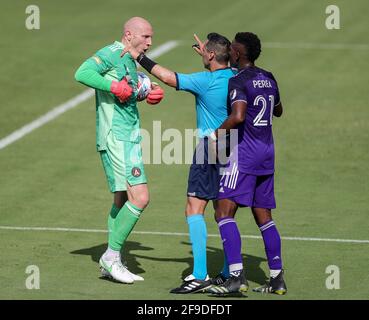 Orlando, Florida, USA. April 17, 2021: Atlanta United goalkeeper BRAD GUZAN (1) argues with Orlando City SC midfielder ANDRES PEREA (21) while the official intervenes during the Orlando City vs Atlanta United match at Exploria Stadium in Orlando, Fl on April 17, 2021. Credit: Cory Knowlton/ZUMA Wire/Alamy Live News Stock Photo