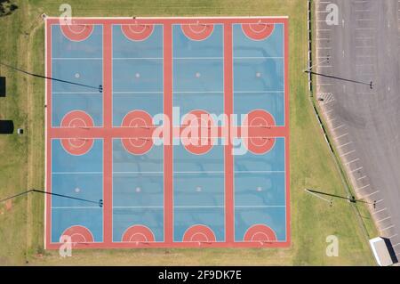 Drone aerial photograph of colourful netball courts and large sports ...