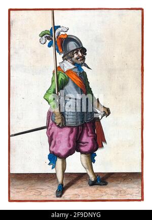 A full-length soldier holding a spear (lance) in his right hand leaning against his right arm vertically Stock Photo