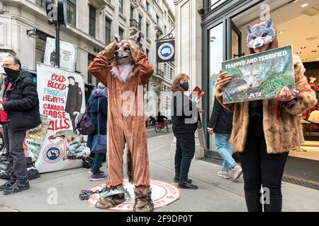 London UK. 18th Apr 2021. Activist seen holding a placard expressing his opinion during the demonstration.Animal cruelty activists Peta UK People for the Ethical Treatment of Animals protest against t...