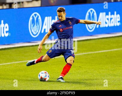 Chicago, USA, 17 April 2021. Major League Soccer (MLS) Chicago Fire FC midfielder Przemyslaw Frankowski (11) kicks the ball against the New England Revolution at Soldier Field in Chicago, IL, USA. Match ended 2-2. Credit: Tony Gadomski / All Sport Imaging / Alamy Live News Stock Photo