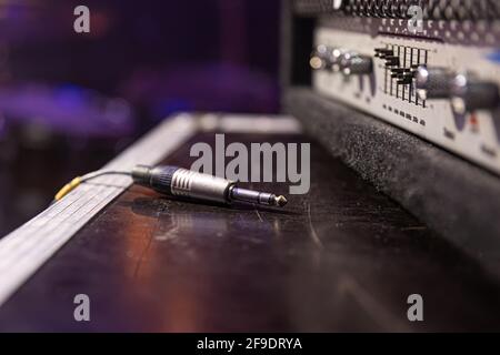 Jack audio connector being plugged into a socket on an audio device for music, audio. Stock Photo