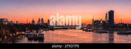 LONDON, UK - OCTOBER 01, 2011:  Panorama view of London skyline from Waterloo bridge east along the River Thames toward the City of London at dawn Stock Photo