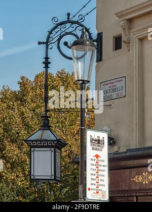 LONDON, UK - OCTOBER 01, 2011:  Vintage lamp and Street Sign for Portobello Road Antiques Market Stock Photo