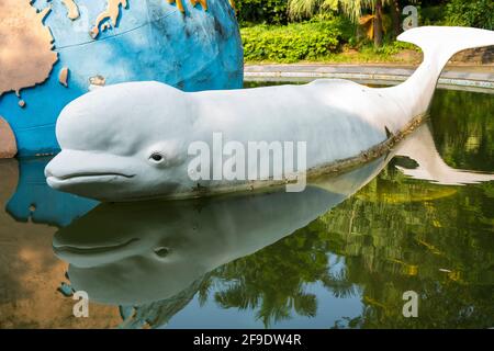 Shenzhen, China. October, 2019. Stone white dolphin in Shenzhen International Garden and Flower Expo Park. The park serves multiple functions, includi Stock Photo