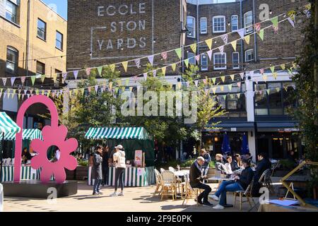 EDITORIAL USE ONLY Merchants at Eccleston Yards welcome customers back to the neighbourhood of Mayfair/ Belgravia on the first weekend since lockdown restrictions were eased earlier this week, London. Picture date: Saturday April 17, 2021. Stock Photo