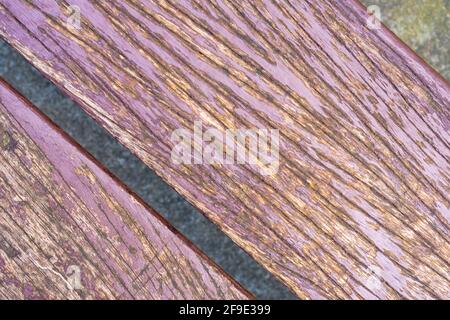 Cracked weathered texture of a wooden bench close up Stock Photo