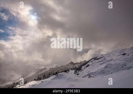 Clouds carrying snow in the italian alps Stock Photo - Alamy