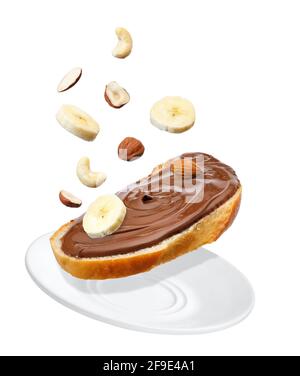 flying bread with chocolate cream isolated on white Stock Photo