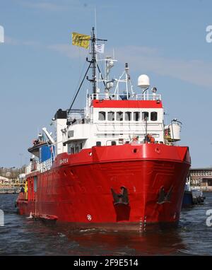 Rostock, Germany. 17th Apr, 2021. The sea rescue ship 'Sea-Eye 4' departs from the fishing port to head for the Mediterranean. The former offshore supply ship, built in 1972, had been prepared for deployment in the Polish port of Swinoujscie and in Rostock over the past few months. The 55-metre-long ship belonging to the Regensburg-based aid organisation Sea-Eye offers plenty of space for the initial treatment of rescued people. Credit: Bernd Wüstneck/dpa-Zentralbild/dpa/Alamy Live News Stock Photo