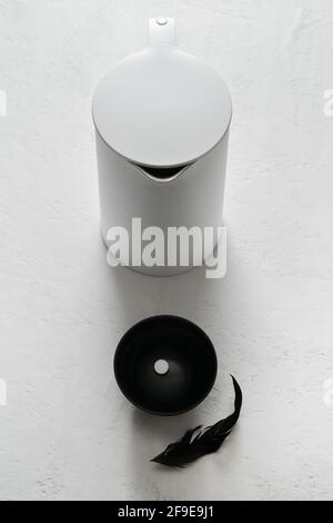 Top view white teapot along with a glass Stock Photo