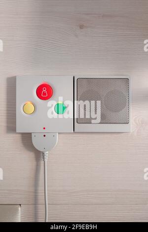 Close up of nurse call system with emergency buttons installed near bed in medical room in hospital Stock Photo
