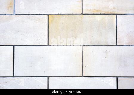 Background from a wall with rectangular white stone slabs Stock Photo