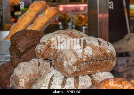 Different shapes and types of bread are on sale inside Adelaide Central Market, South Australia Stock Photo